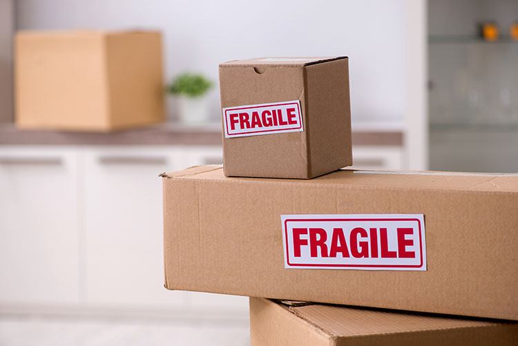 moving and storage boxes labeled as fragile